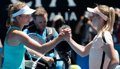 Elise Mertens, left, and Elina Svitolina greet each other at the net after their quarter final match at the Australian Open. Mast Irham / EPA