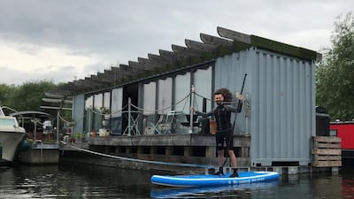 British upcycler Max McMurdo built his own boat home out of an old shipping container and now lives on the vessel full-time. Courtesy Max McMurdo