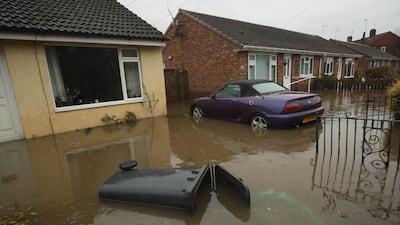 A house surrounded by floodwater in Fishlake, Doncaster in late 2019. PA