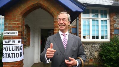United Kingdom Independence Party leader, Nigel Farage, arrives to cast his vote in Biggin Hill, south eastern England. Gareth Fuller / PA via AP