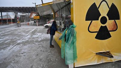 A visitor stands in front of a souvenir booth next to the Dytyatky control point at an entrance to Chernobyl’s exclusion zone. AFP