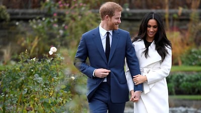 The couple walk in the royal grounds. Toby Melville / Reuters