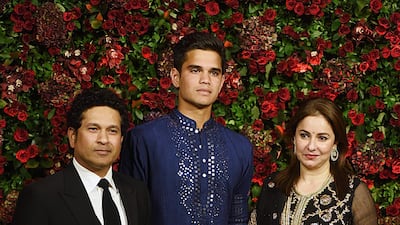 Sachin Tendulkar with his son Arjun and wife Anjali. AFP