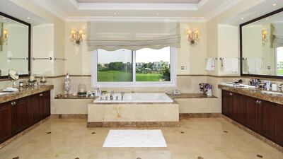One of the six bathrooms, also with golf course views. Courtesy Better Homes