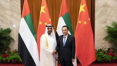Sheikh Mohamed bin Zayed stands for a photograph with Chinese Premier Li Keqiang at the Great Hall of the People in Beijing. Ministry of Presidential Affairs