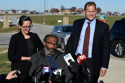 Kevin Strickland, centre, with his attorneys. Mr Strickland was jailed for more than 40 years for three murders. He was released after a judge ruled that he was wrongfully convicted in 1979. AP