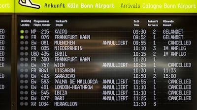 A display at Cologne Bonn Airport shows delays and flight cancellations, after climate activists caused an interruption to air traffic during a protest at Cologne/Bonn Airport, Germany, Wednesday July 24, 2024. (Thomas Banneyer / dpa via AP)