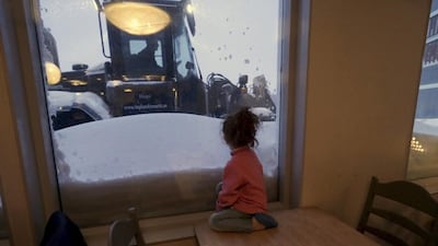 A refugee girl looks outside of her camp at a hotel touted as the world’s most northerly ski resort in Riksgransen, Sweden. Ints Kalnins / Reuters