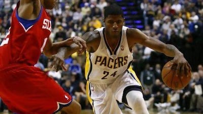 Indiana Pacers guard Paul George drives past a Philadelphia 76ers player on Saturday.