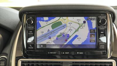 The car's tech includes lane-departure warning, forward-collision detection, blind-spot warning, parking sensors and head-up display. Victor Besa / The National