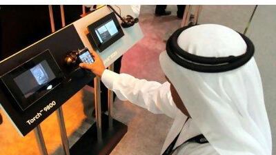 A visitor inspects a BlackBerry device at last year's Gitex. EPA