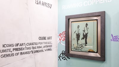 Two of Banksy's street art pieces are on display. Photo: World Art Dubai
