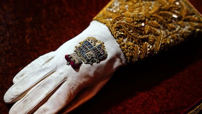 The Coronation Gauntlet, a glove symbolising royal authority, features detailed embroidery of national emblems