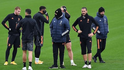 Juventus' Dejan Kulusevski with Cristiano Ronaldo as Andrea Pirlo, right, and Leonardo Bonucci look on during training. AFP
