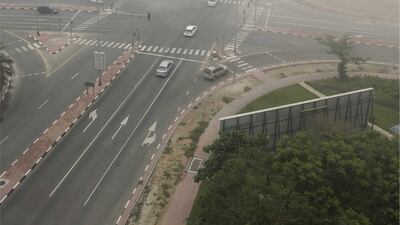 Early morning fog is seen at a crossroads junction, close to Ibn Batutta Mall in Dubai. James O'Hara / The National