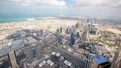 A view of DIFC, Sheikh Zayed Road and Jumeirah beach from the open deck from 152 floor of The Lounge. Photo: Leslie Pableo for The National