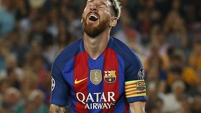 Barcelona's Lionel Messi reacts to one of his three goals Tuesday night against Celtic. Albert Gea / Reuters