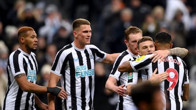 Newcastle United players celebrate after Bournemouth's Adam Smith scored an own goal during the League Cup fourth round match at St James' Park on December 20, 2022. Newcastle won the game 1-0. Getty