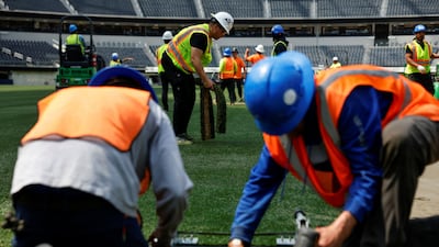 Workers install grass pitch at the LA Stadium in Inglewood, California. Reuters