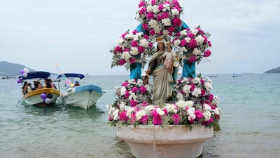 A boat is decorated with a statue of the Virgen del Carmen ready for an ocean procession honouring the patron saint of fishermen and sailors in Taboga island, near Panama City. AFP
