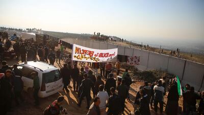 Syrians gather during a symbolic protests in the city of Harim in the rebel-held northern countryside of Syria's Idlib on the border with Turkey on January 2, 2020. AFP