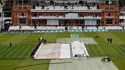 Groundstaff remove the covers before play. Action Images via Reuters