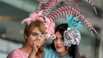 Racegoers pull out all the stops with fantastic fascinators and outfits. AFP