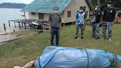 A dugong after it was found dead on a beach at Koh Lanta island, in Krabi province, southern Thailand. The female animal was about three metres long and weighed 300 kilograms. EPA