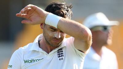 James Anderson of England wipes his face during his bowling spell on Day 1 against Pakistan of the first Test in Abu Dhabi. Francois Nel / Getty Images