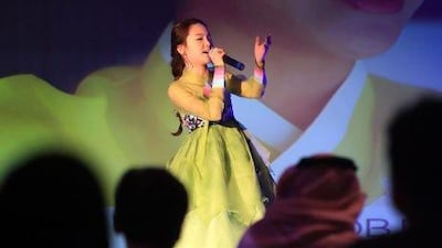 Song Sehoo, a 16-year-old winner of Korea's Got Talent, serenaded Emirati and Korean businessmen during yesterday's inauguration of the Korea Development Bank representative office in Abu Dhabi. Ravindranath K / The National