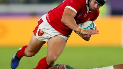 Wales' Leigh Halfpenny (left) is tackled by South Africa's Damian de Allende during the 2019 Rugby World Cup Semi Final match at International Stadium Yokohama. PA Photo
