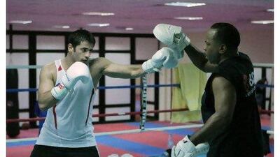 UAE boxer Eisa al Dah training with his coach Anthony "Chill" Wilson, from USA, at Bel Rematha Sports Centre.