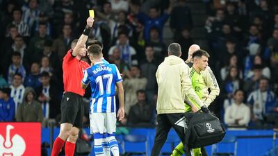Referee Georgi Kabakov shows a yellow card to United defender Lisandro Martinez. Getty