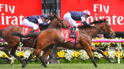 Corey Brown, on-board Rekindling, beat Ben Melham riding Johannes Vermeer and Zac Purton riding Max Dynamite to win the Melbourne Cup. Vince Caligiuri / Getty Images