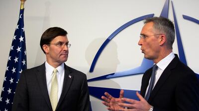 Nato Secretary General Jens Stoltenberg, right, and US Secretary for Defence Mark Esper participate in a media conference in Brussels AP