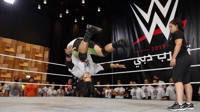 Wannabe wrestlers hoping for a chance to join the popular World Wrestling Entertainment franchise took to the ring in Dubai on Thursday. Here one of the 40 selected hopefuls shows off his moves at the WWE tryouts, which were held at Dubai Opera. Chris Whiteoak for The National