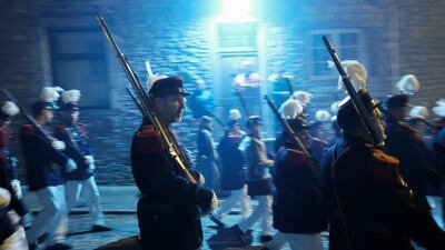 The event begins in darkness. Olivier Hoslet / EPA