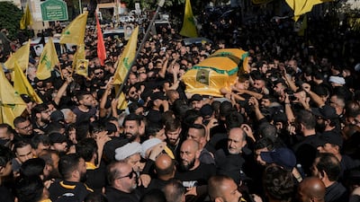 Mourners attend the funeral of Abu Ali Khalil, the bodyguard and head of security for late Hezbollah leader Hassan Nasrallah, in Dahieh, southern Beirut, on Thursday. He was killed in an Israeli air strike in Iran on June 21. AP Photo