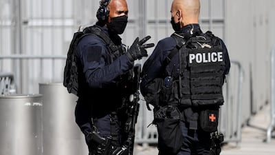 Police officers patrol outside. AFP