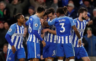Pascal Gross celebrates with teammates after scoring Brighton and Hove Albion;s third and final goal. Matthew Childs / Reuters