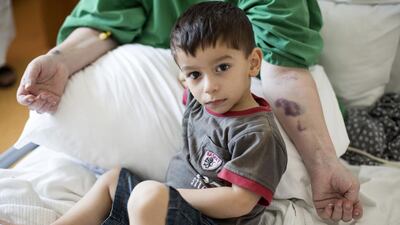 Siham Mahmoud, from Syria, is suffering from cancer. She needs someone to sponsor her so that she can get treatment. Her son and husband are always with her at the hospital. Irene Garcia Leon / The National.