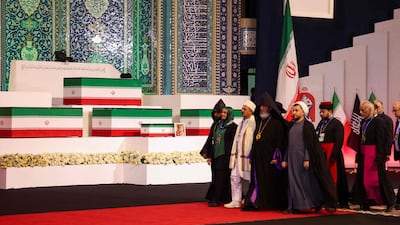 Dignitaries walk past the coffins of Ayatollah Ali Khamenei and his relatives at the Imam Khomeini Grand Mosalla in Tehran. AFP