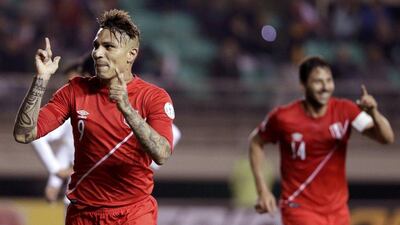 Paolo Guerrero, left, scored all three Peru goals in their quarter-final victory over Bolivia. Jorge Adorno / Reuters / June 25, 2015