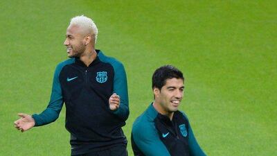 Barcelona players Neymar, left, and Luis Suarez attend a training session in Monchengladbach. Roberto Pfeil / AFP