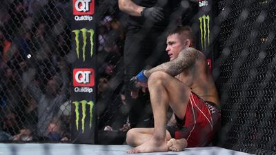 Dustin Poirier reacts following his loss by submission against Charles Oliveira. Reuters