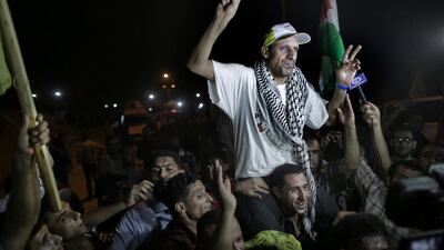 A freed Palestinian prisoner is welcomed upon his arrival near the Erez crossing, between Israel and Gaza in the Northern Gaza Strip. EPA / ALI ALI