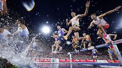 Athletes take on the water jump in the 3000m Men's Steeplechase Final at the European Athletics Championships in Birmingham, Britain. EPA