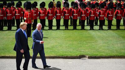 US President Donald Trump (L) walks with Britain's Prince Charles, Prince of Wales after inspecting the honour guard during a welcome ceremony at Buckingham Palace in central London on June 3, 2019, on the first day of the US president and First Lady's three-day State Visit to the UK. AFP