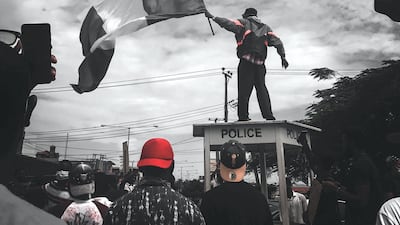 The photograph of Flagboy that went viral in October 2020. Courtesy: Ayodeji Adegoroye