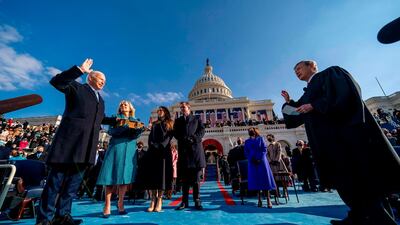 Joe Biden, left, is sworn in as the 46th president of the United States by Chief Justice John Roberts as Jill Biden holds the Bible, alongside son Hunter Biden and daughter of Joe and Jill Biden Ashley Biden in Washington. AFP